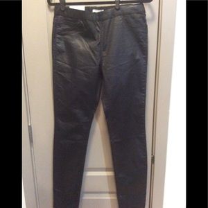 Black stretch coated jeans.